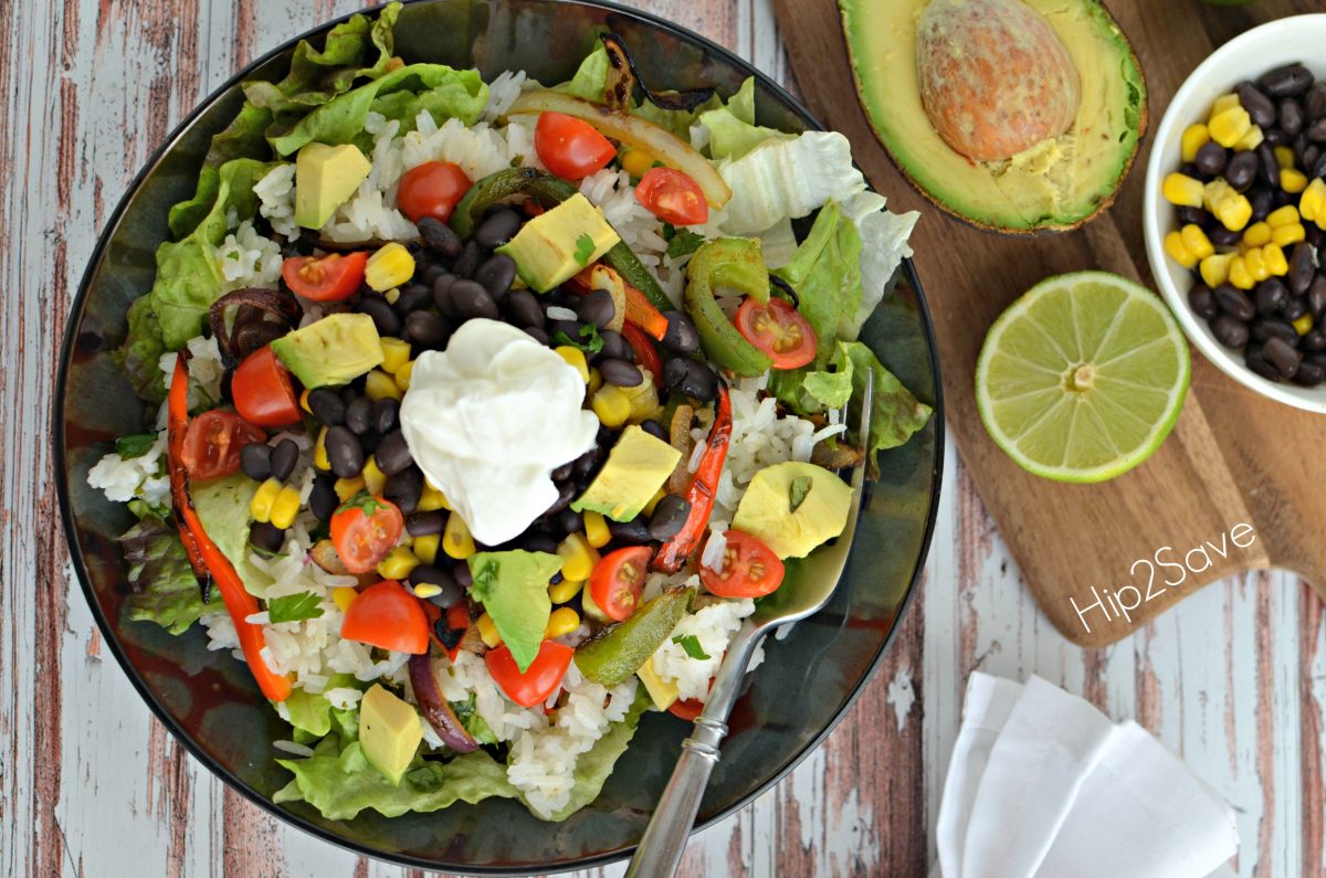 homemade Chipotle burrito bowl with avacado and lime on the side