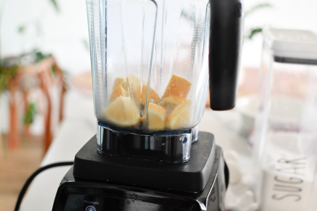 Pieces of lemon inside a blender.