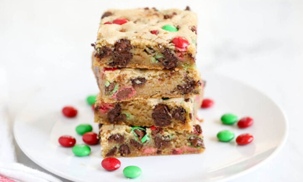 M&Ms cookie bars stacked on a white plate