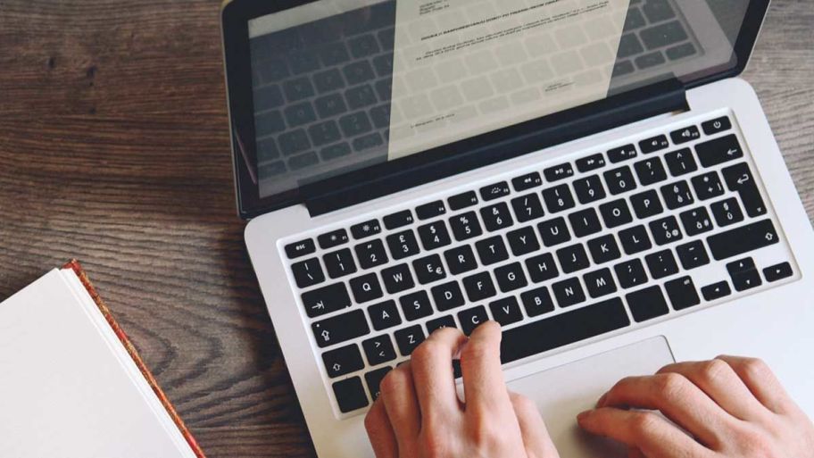 Person on Computer looking for ways to make extra money