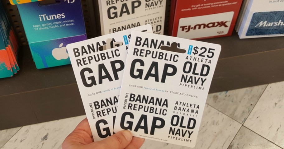hand holding 2 gap brand gift cards