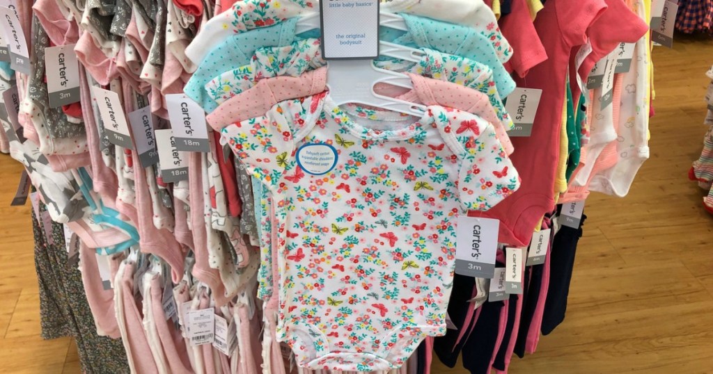 Carter's bodysuits on a hanger