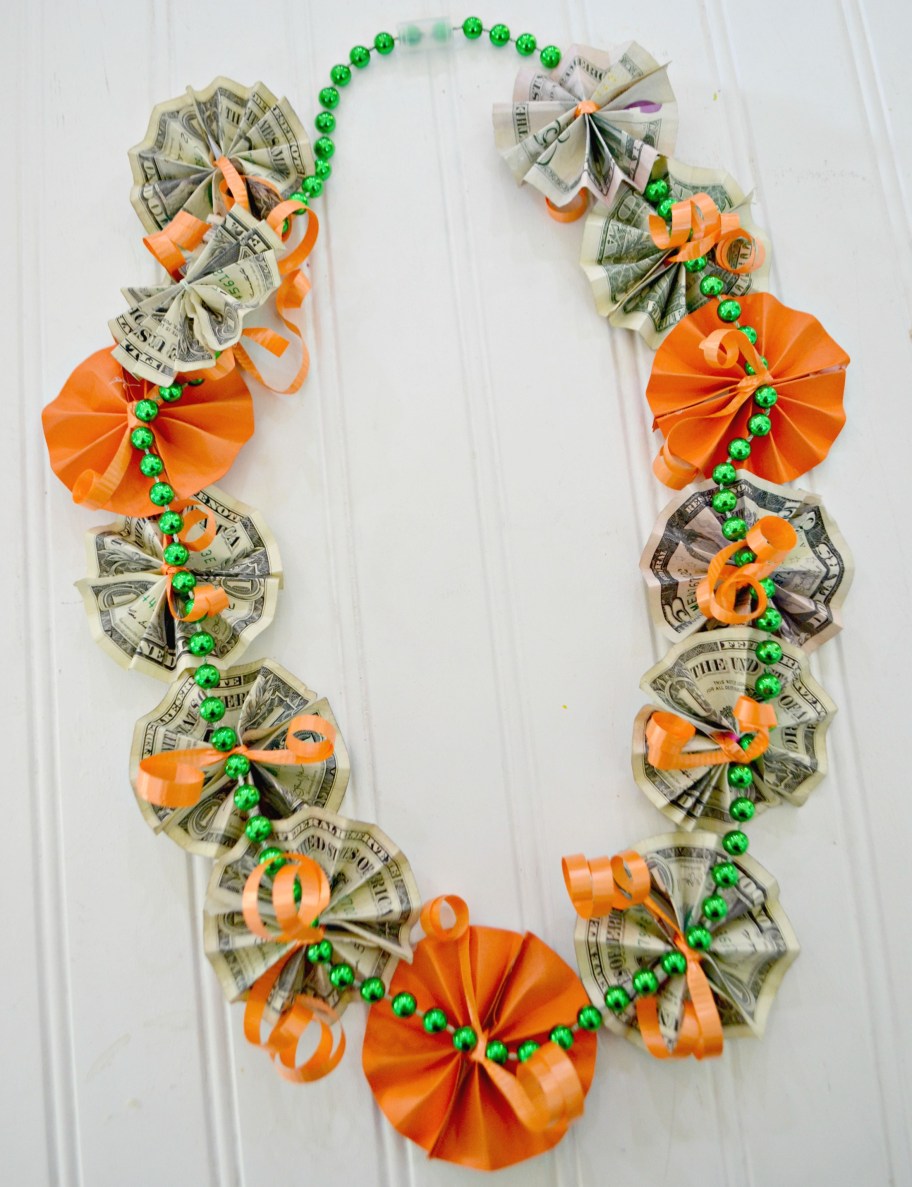 graduation money lei made from paper flowers and dollar bills