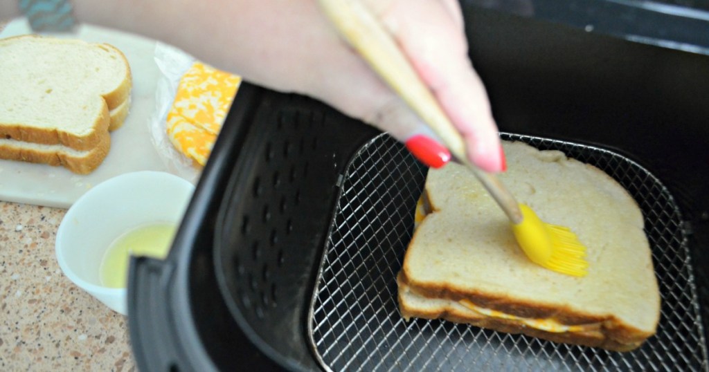 spreading butter on a slice of bread 