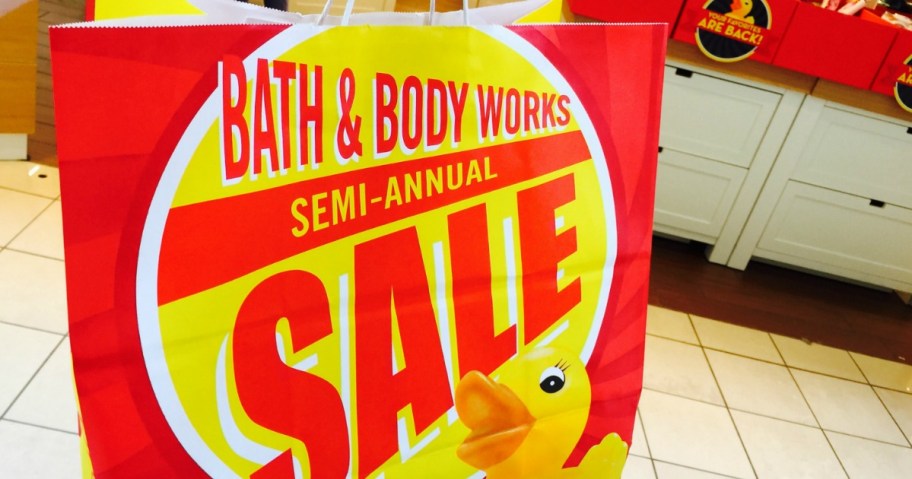 red and yellow Bath & Body Works Semi-Annual Sale shopping bag