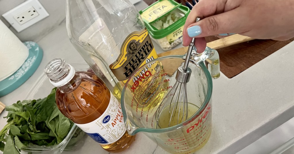 whisking together corn salad ingredients