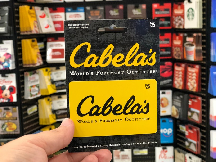 cabela's gift card in hand in store