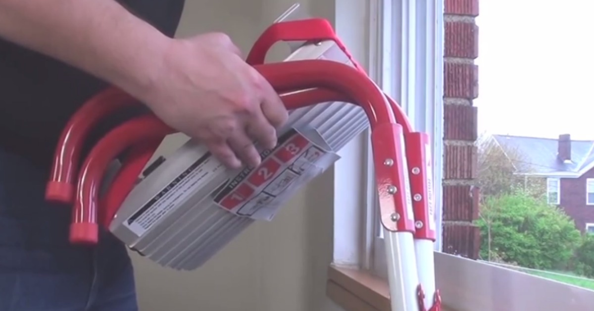 person holding a fire escape ladder