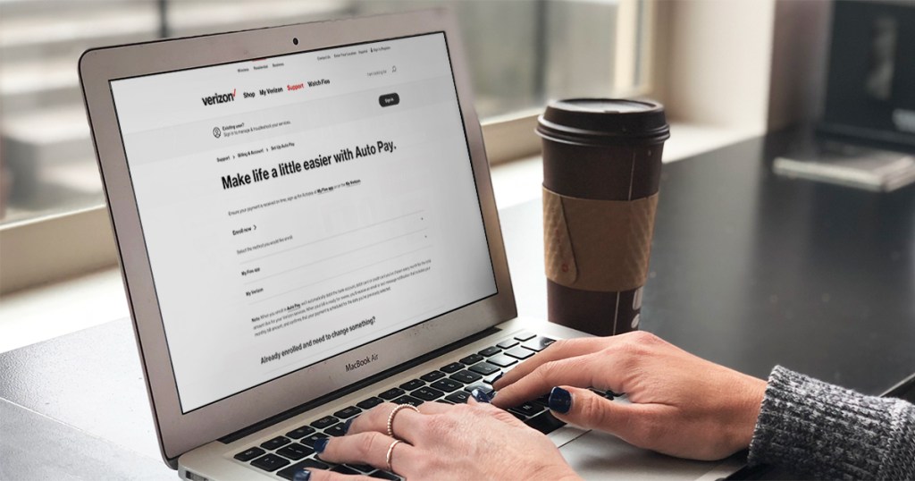 woman with auto pay verizon screen on computer