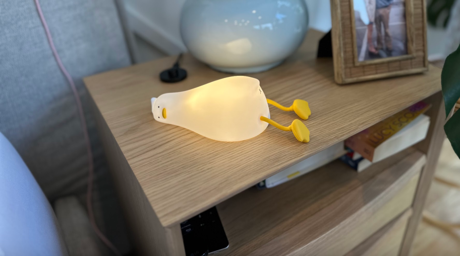 Duck night light turned on laying on nightstand