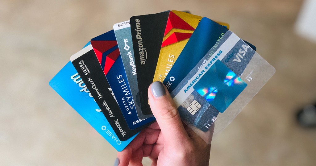 hand holding fan of credit cards