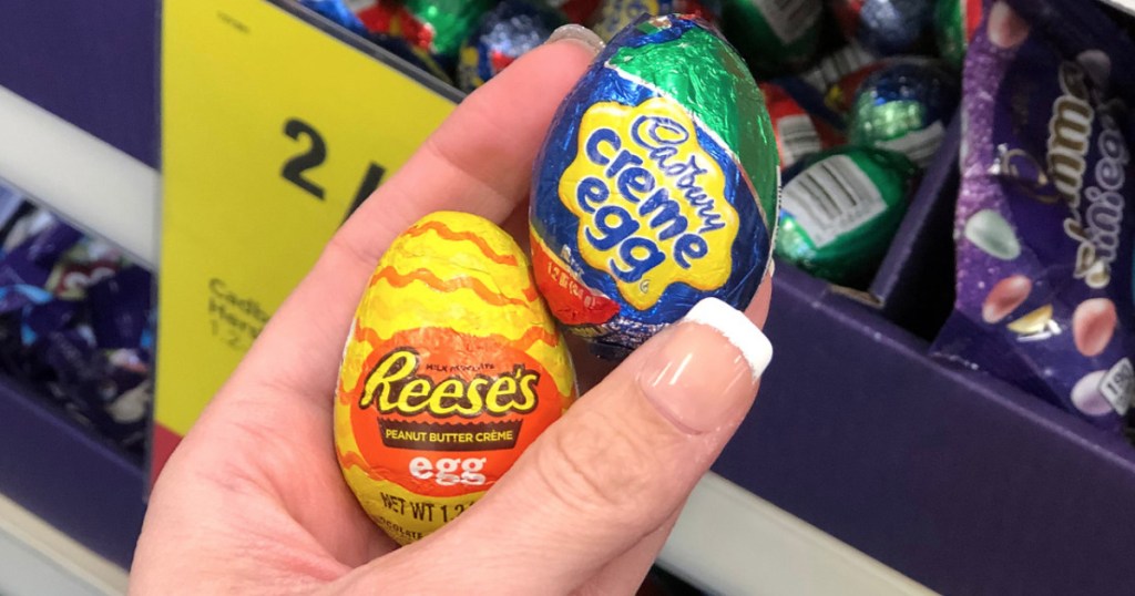 hand holding foil-wrapped eggs