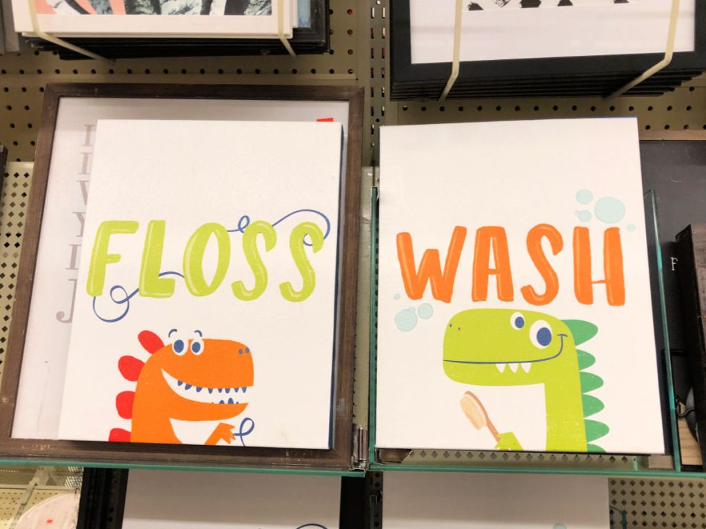 Dinosaur Floss and Dinosaur Wash Canvas Sign in Hobby Lobby on shelf