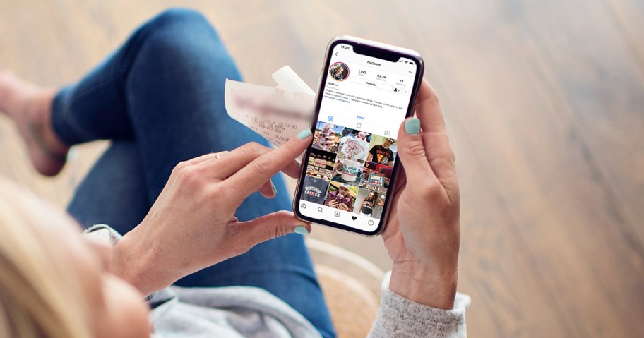 collin holding her smartphone and looking at the hip2save instagram page