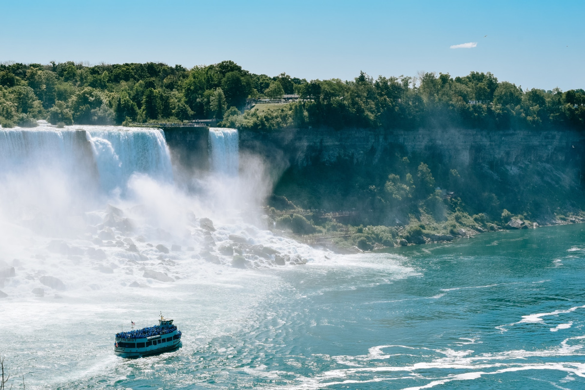 boat in water at the base of cheap family vacation spot niagara falls