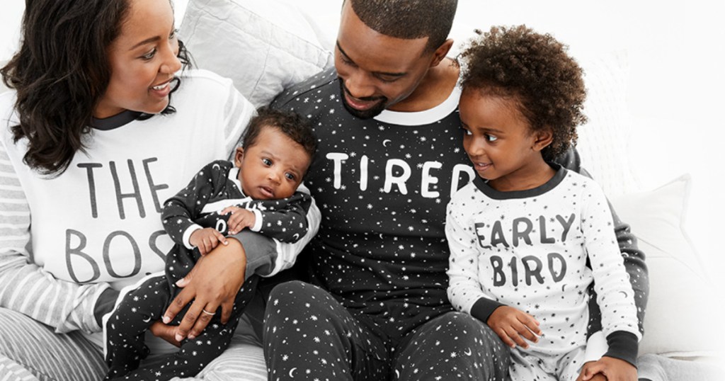 family wearing matching carters pajamas