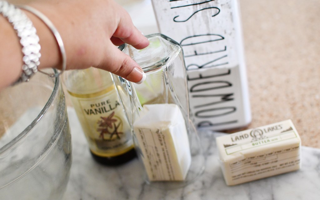 using a glass to soften a stick of butter