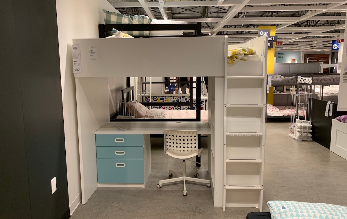 loft bed with blue drawers and ladder