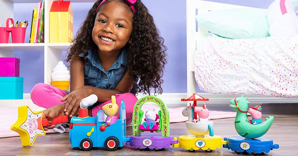 girl playing with Peppa Pig Peppa's Magical Parade in room
