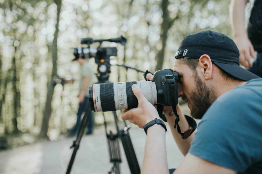 man taking photos, perhaps thanks to one of the random scholarships available to students in 2024