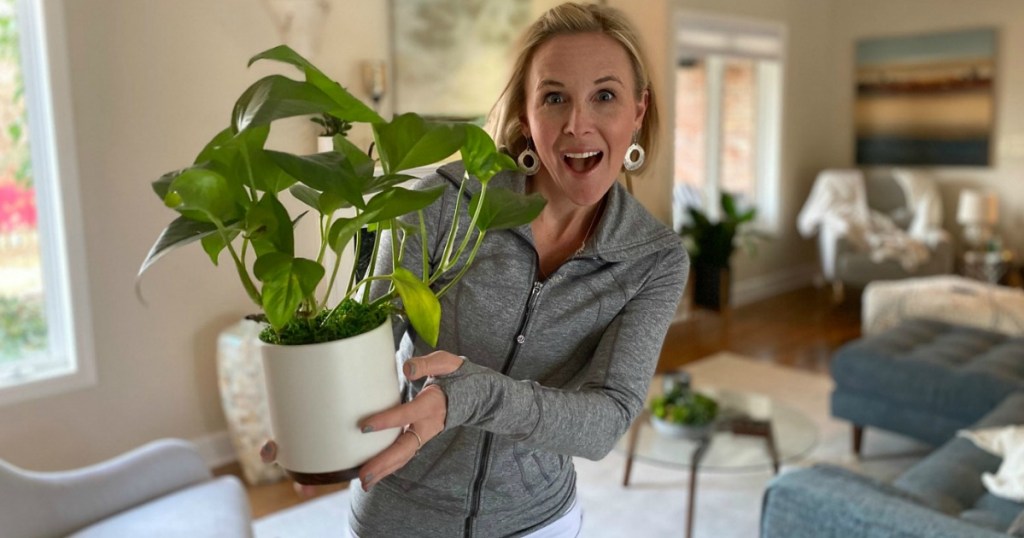 woman holding favorite plant