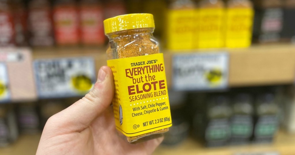 man holding Trader Joe's Everything but the Elote seasoning
