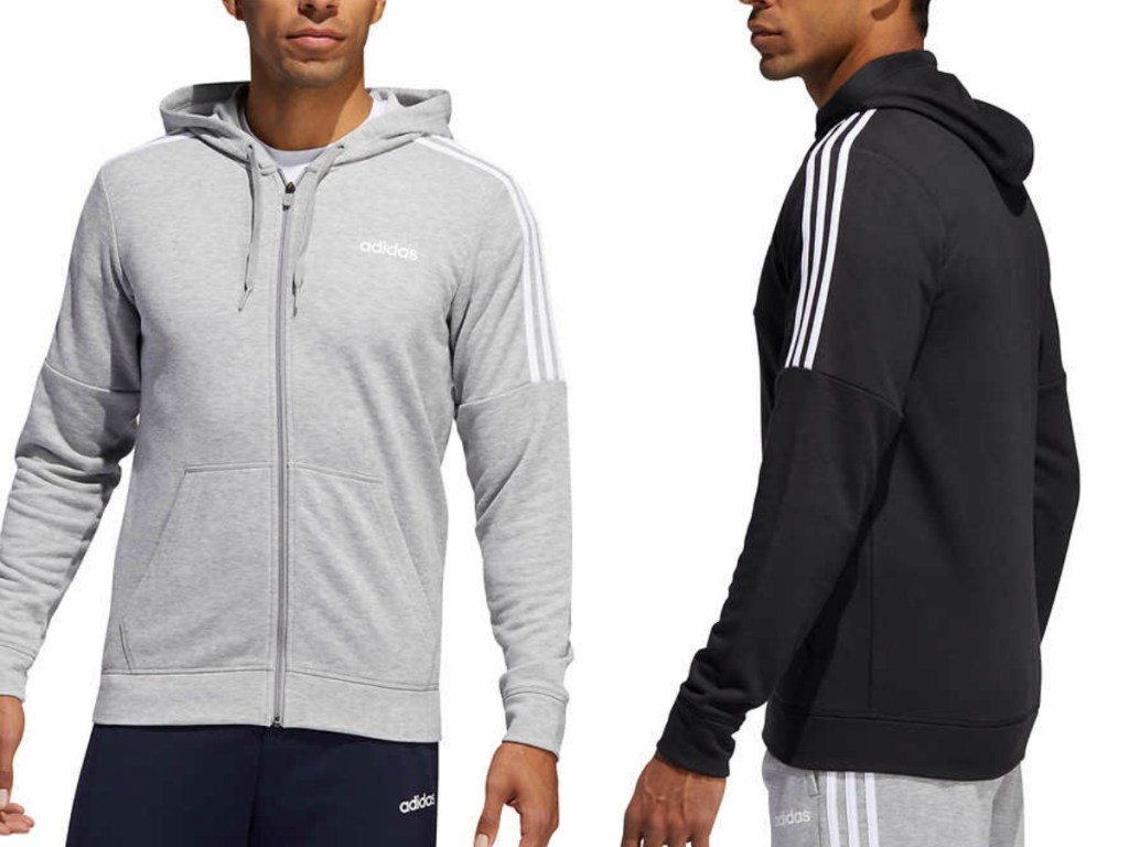 two men wearing zip up sweatshirts on white backgroun