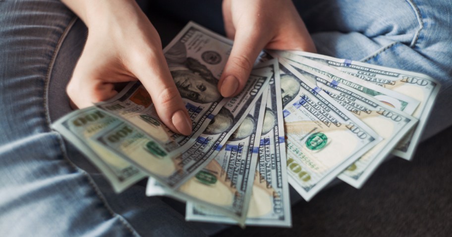 person counting money ways to make extra money