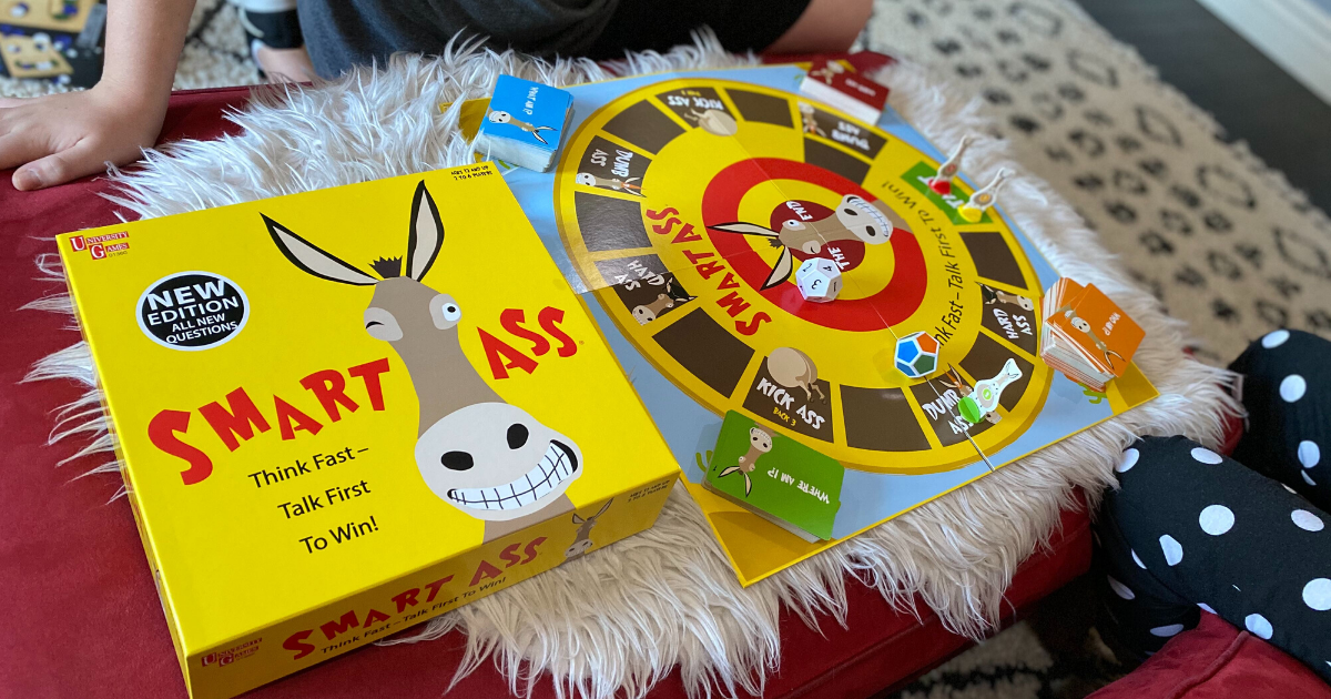Two children playing Smart A** game in living room