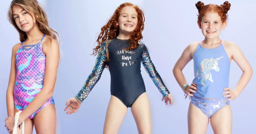three girls in swimsuits smiling