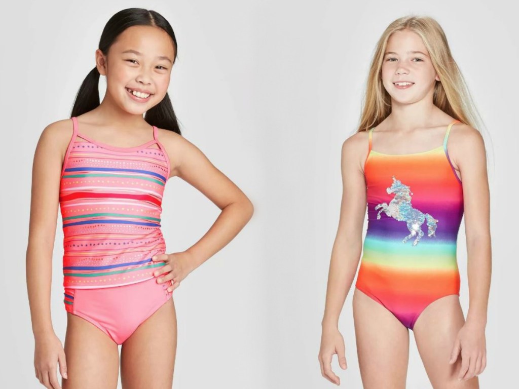 two girls in swimsuits with smiles