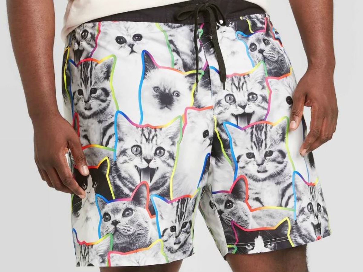 man wearing shorts with cats as the pattern