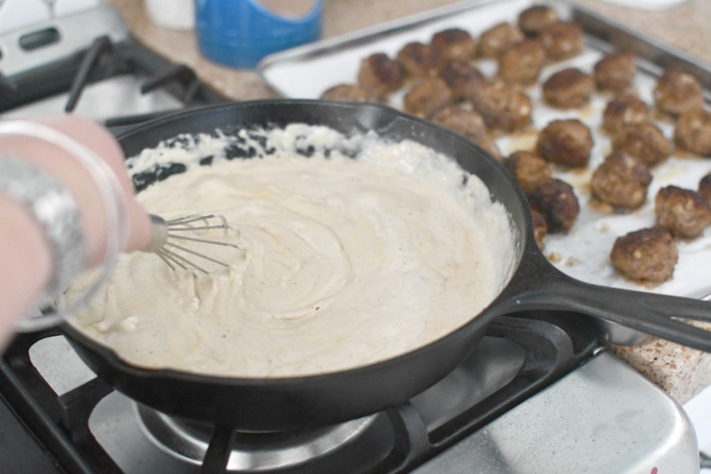 whisking a Swedish cream sauce