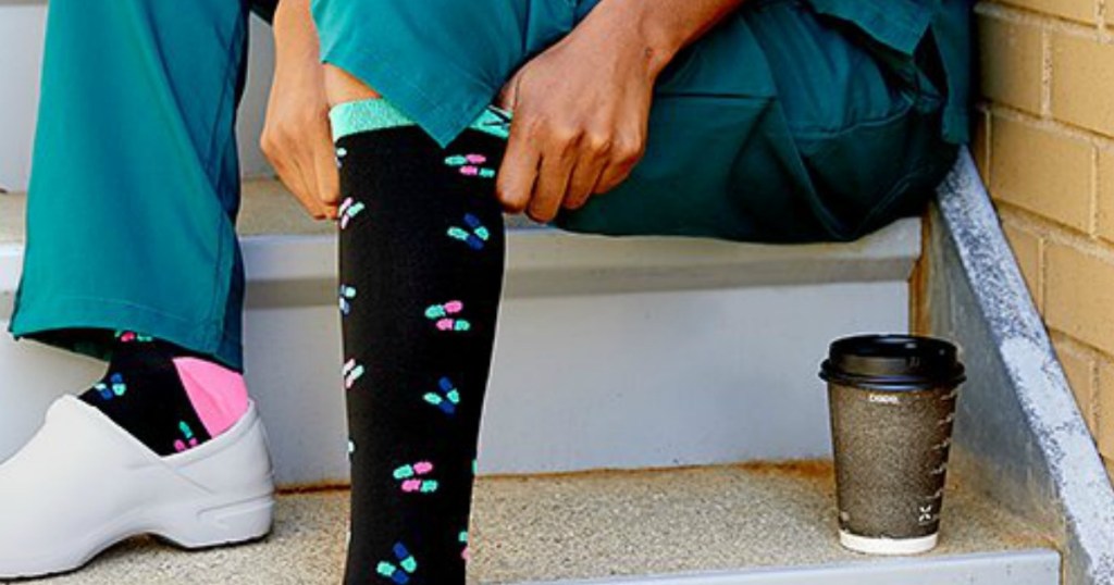 woman pulling up a sock