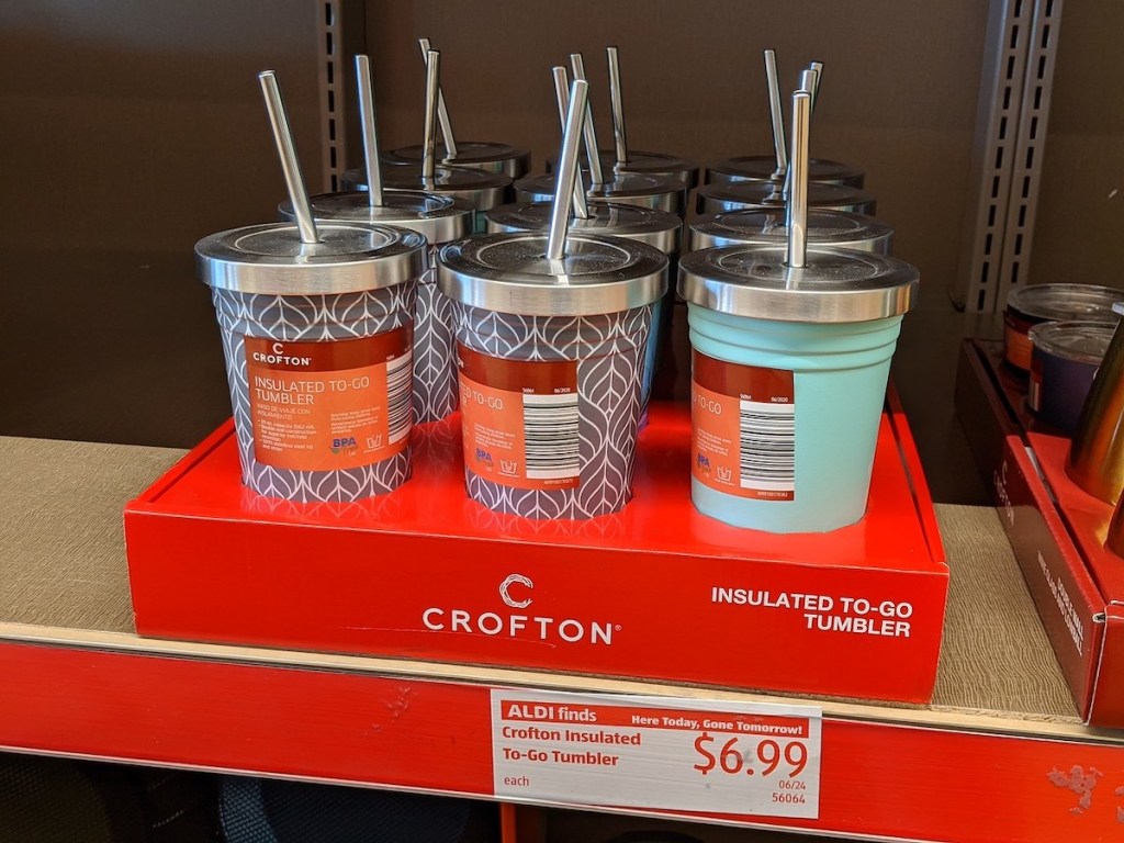 shelf with light blue or grey with white design insulated to-go tumblers at aldi