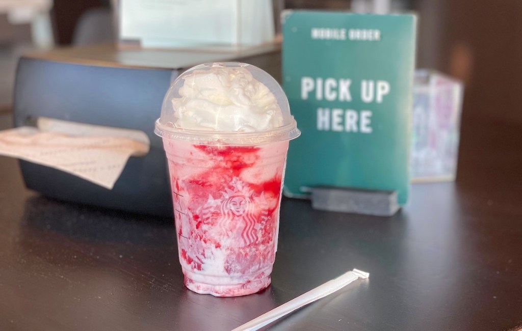 starbucks skittles frappuccino sitting on countertop
