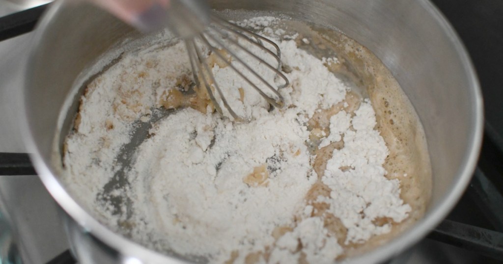 whisking butter and flour in a saucepan