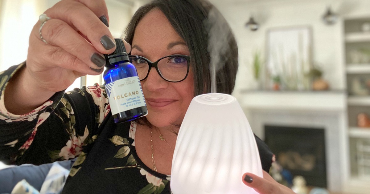 woman diffusing volcano scent