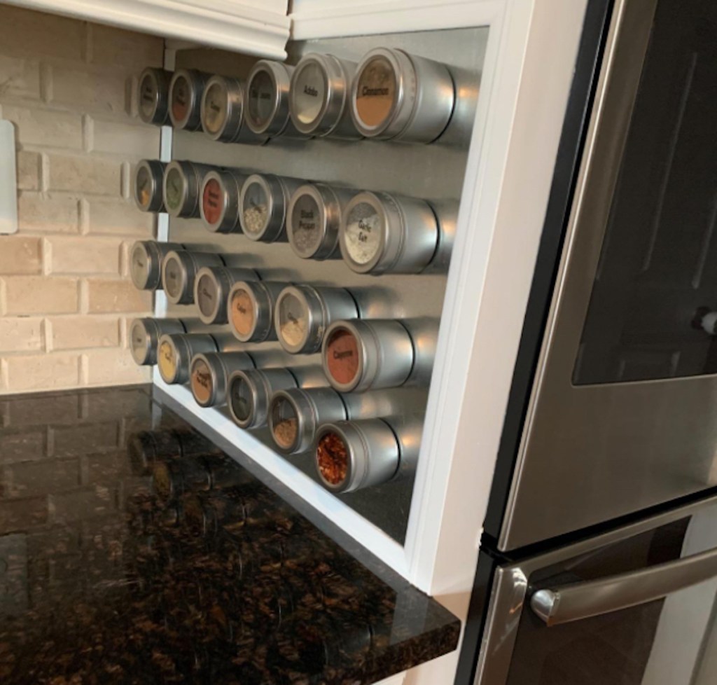 round magnetic spices on side of kitchen wall