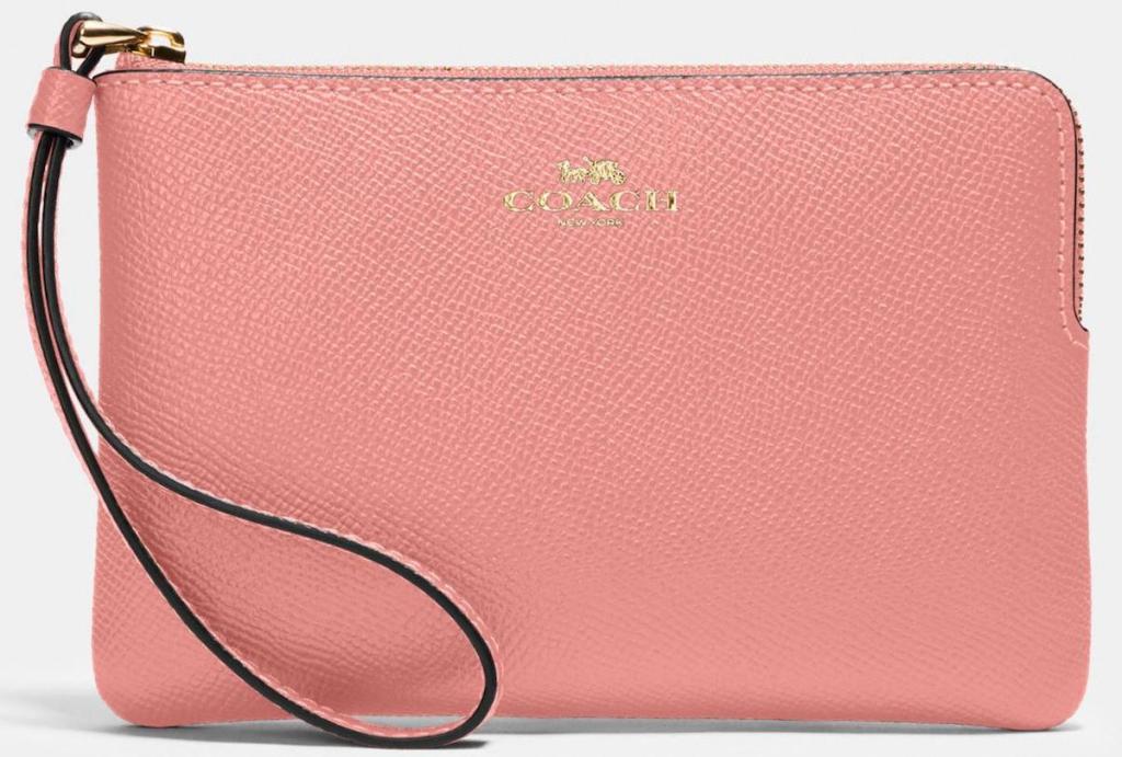 pink colored Coach Corner Zip Wristlet