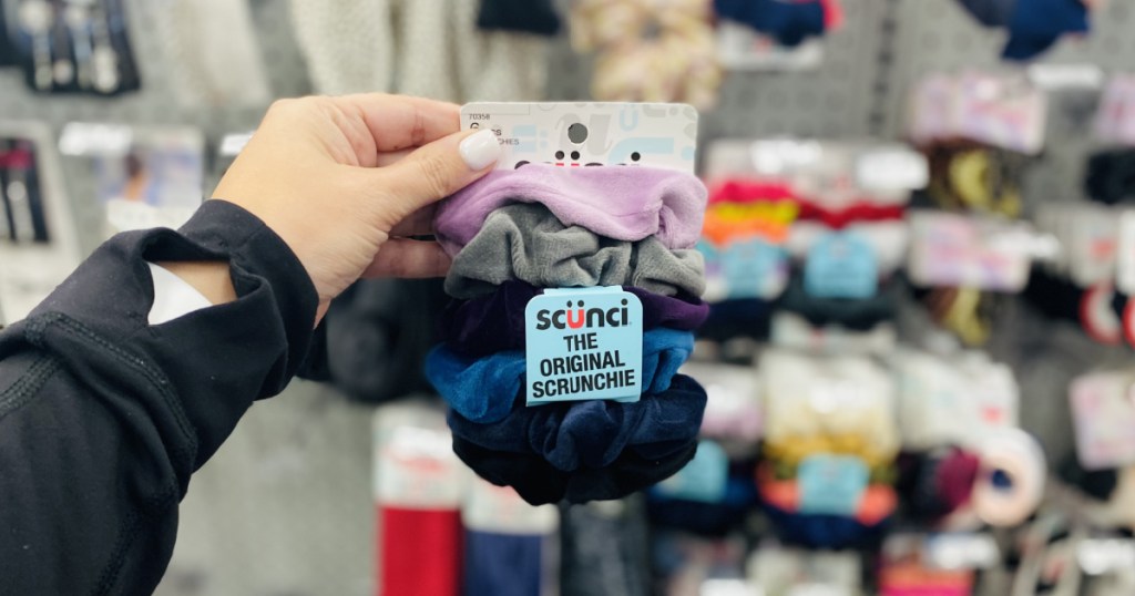 hand holding scrunchies 
