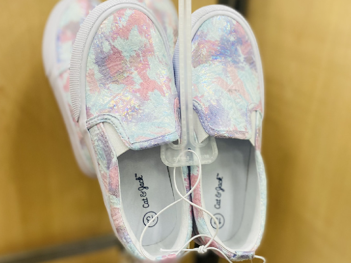 pair of shoes on display in store with multiple colors