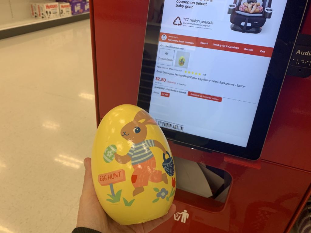 hand holding a wooden egg