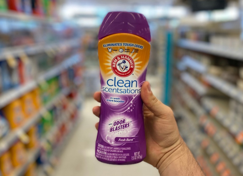 hand holding arm & hammer clean scentsations