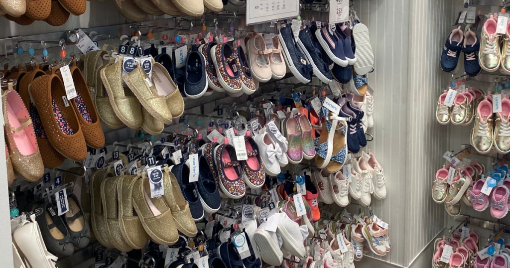 Carter's Baby Shoes on pegs at store