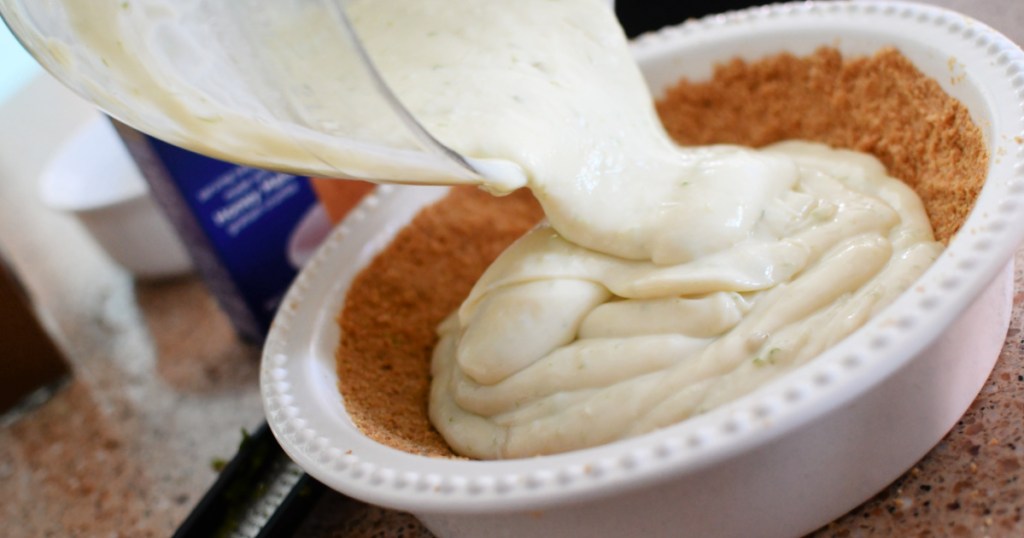 pouring key lime pie into pie pan
