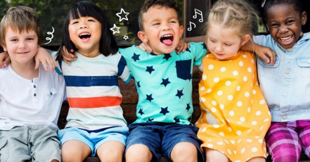 kids sitting together outside having fun