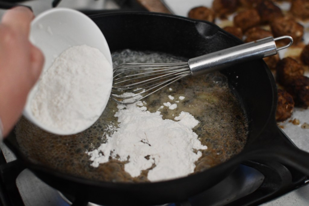 adding flour to butter