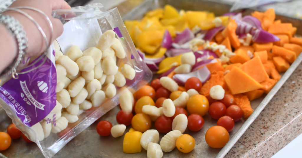 putting package of potato gnocchi on sheet pan 