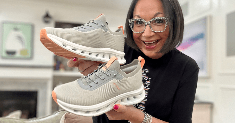 Easy Spirit Sneakers being held by woman